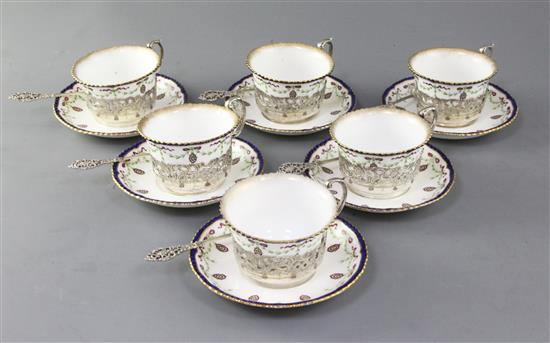 A set of six Royal Worcester porcelain tea cups and saucers, with silver cup holders and spoons,